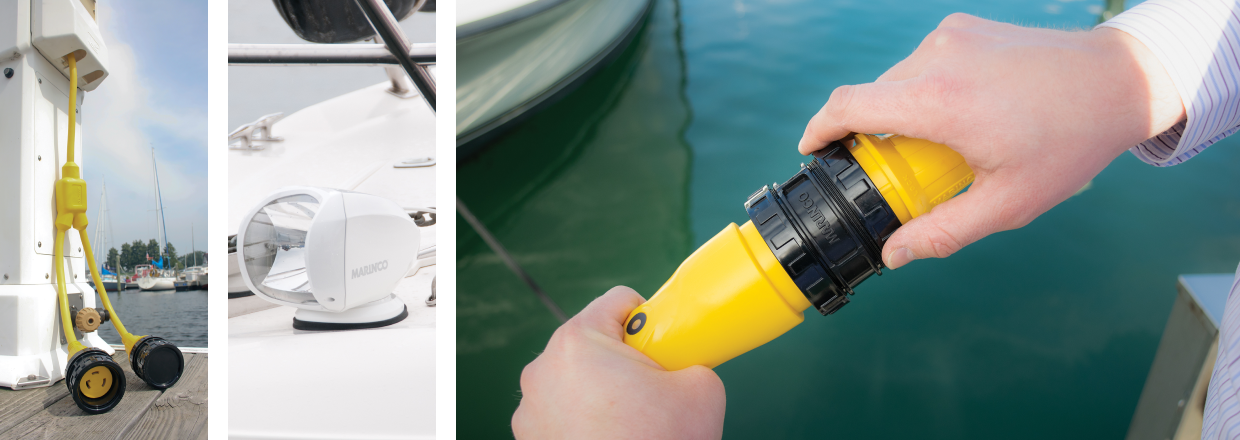 Unplugged yellow shore power cords at a marina. White Marinco lighting fixture for a marine vehicle. Person plugging in Marinco power cords for power.