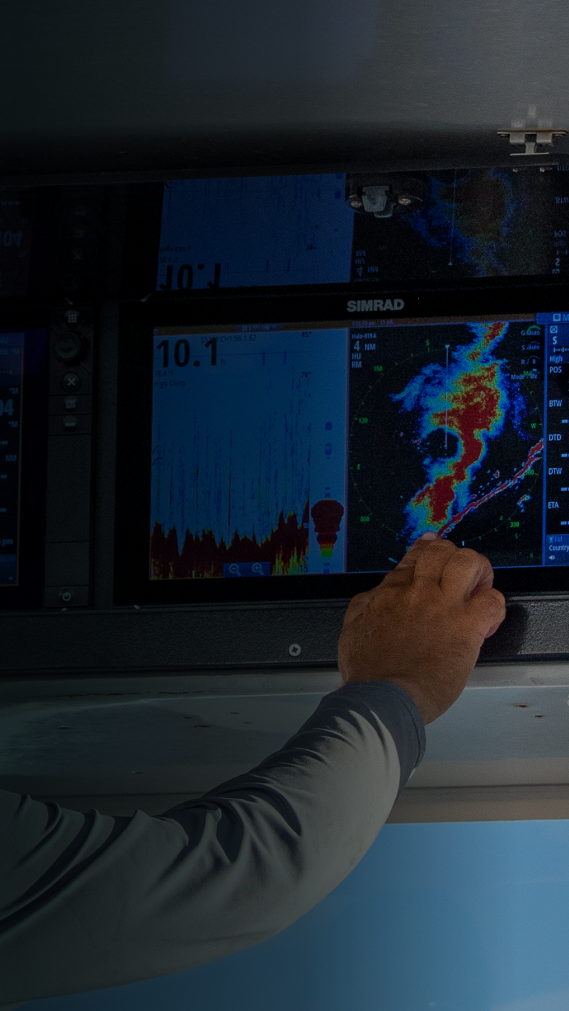 A man reading a chartplotter.